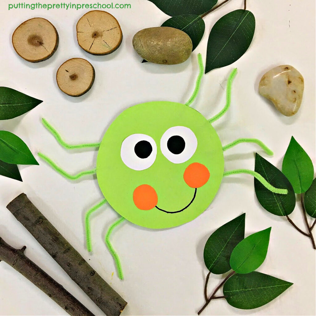 Craft a paper green huntsman spider. The spider won't need a web to be displayed!