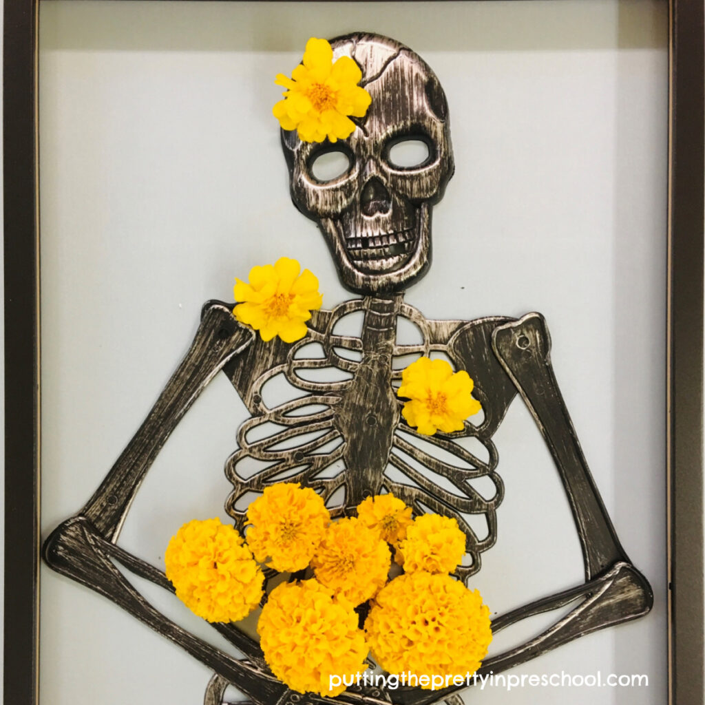 Yellow marigolds brighten up this skeleton and allow children to become floral designers.