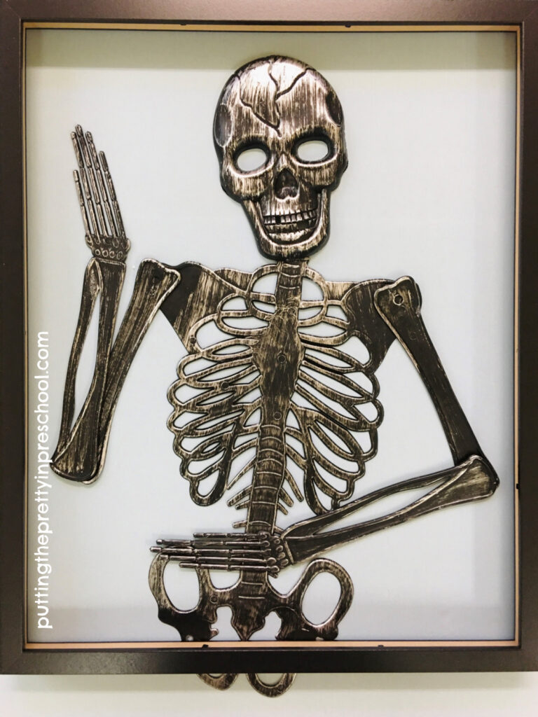 Set a skeleton in a frame and add floral accents to soften up the look.