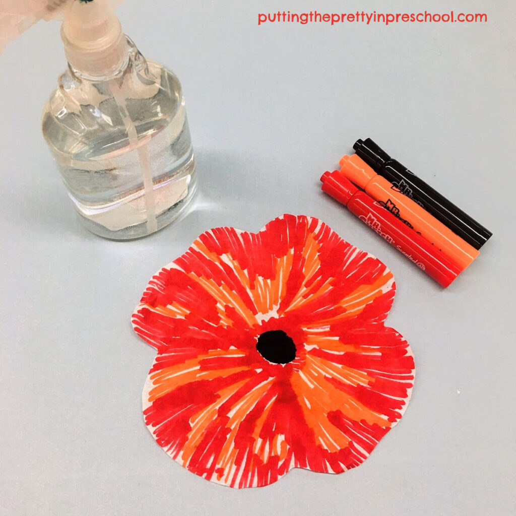 Supplies to make coffee filter poppy art.