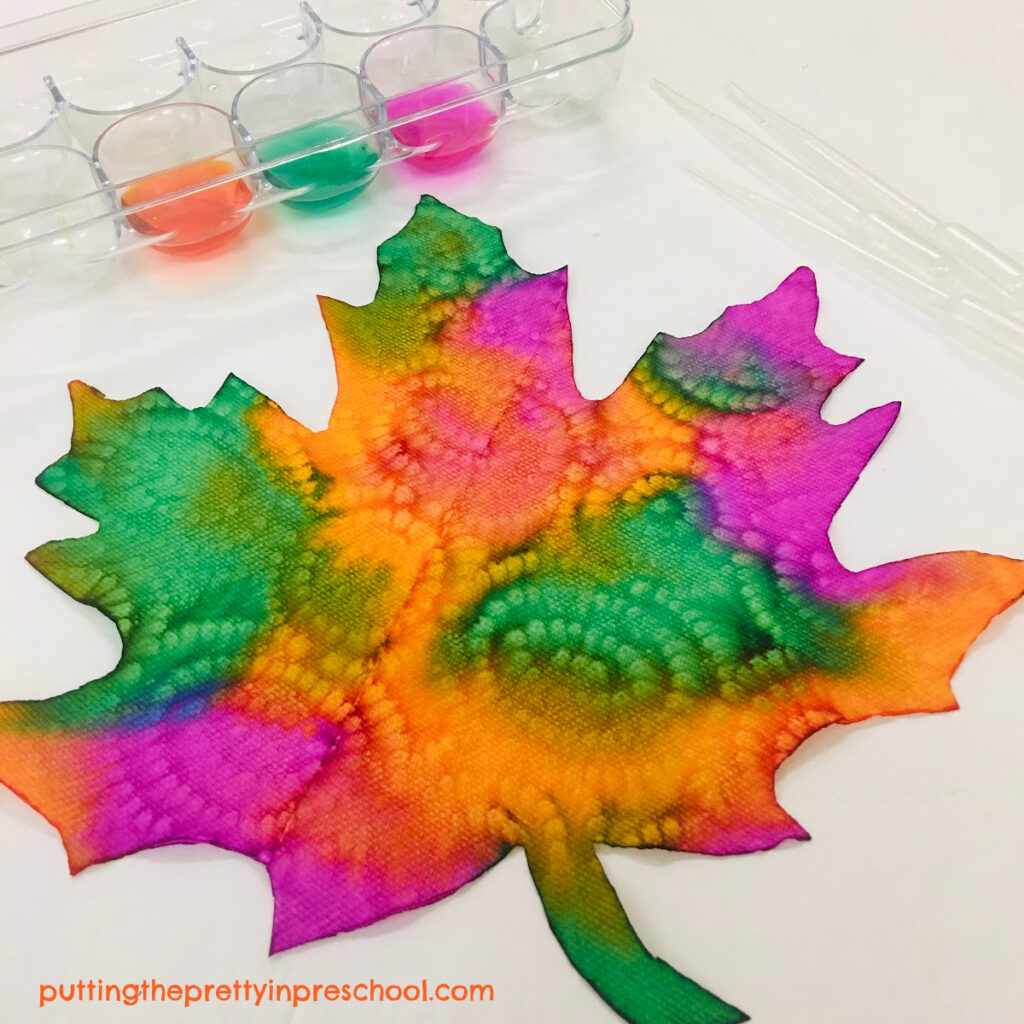 A paper towel pattern accents the design in this eye dropper-painted maple leaf.