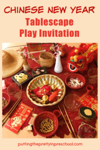 Little learners will love to explore this Chinese New Year tablescape set up filled with Asian artifacts and red and gold loose parts.