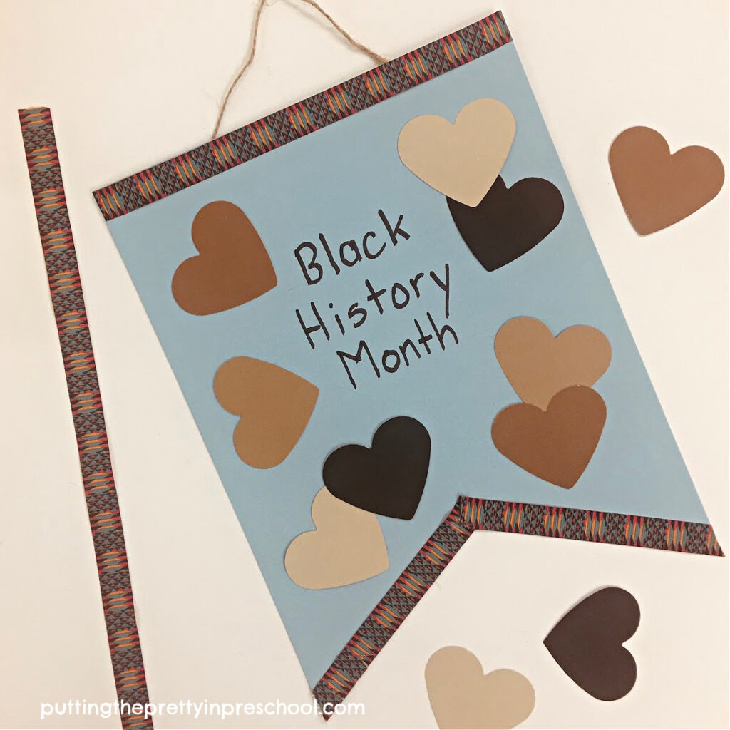 Black History Month ribbon and skin-toned paper hearts are the highlights of this easy-to-make banner craft.
