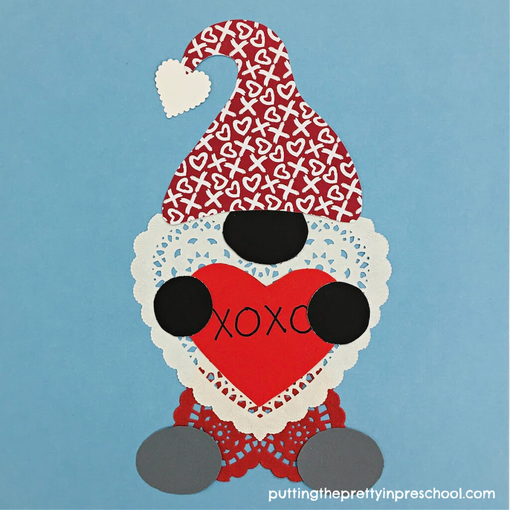 Adorable multicultural gnome valentine with exquisite heart doilies taking center stage.