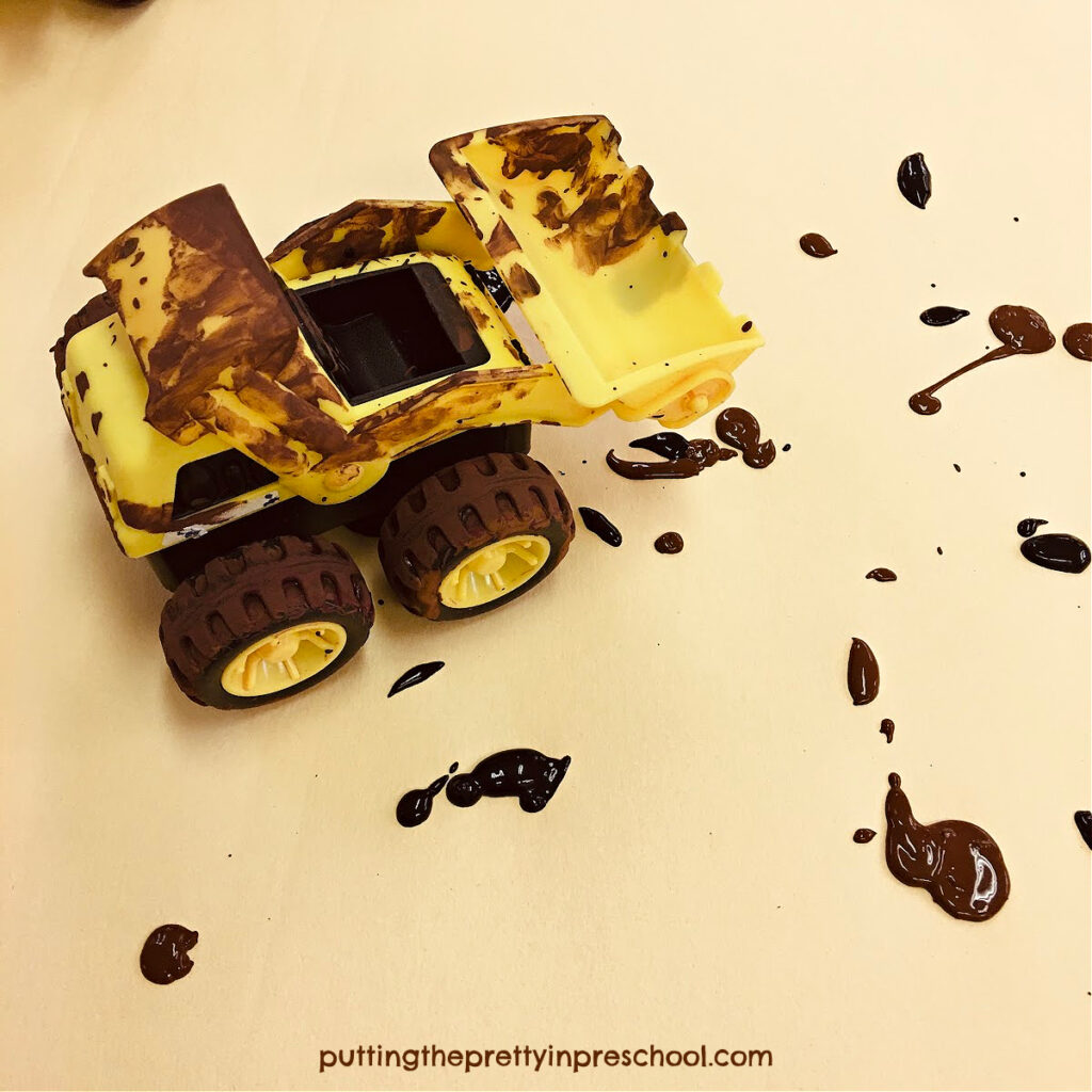 Your little learners will love this messy painting activity. They'll get to make muddy tracks with a toy construction vehicle.