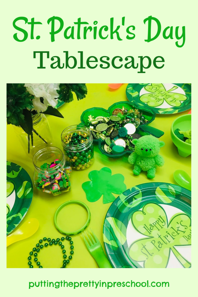 This St. Patrick's Day tablescape is filled with green and gold loose parts, perfect for encouraging imaginative play.
