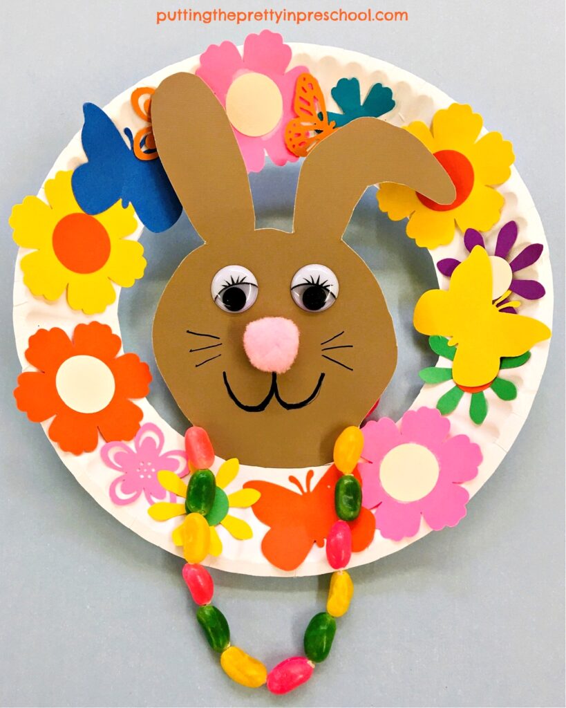 This paper plate bunny wreath will brighten up any space, The jelly bean necklace is the highlight of the craft.