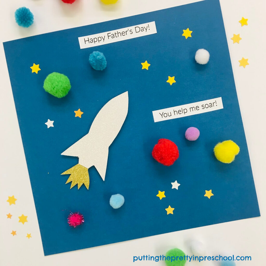 An easy-to-make space Father's Day craft. A glittery spaceship and pompom planets are the highlights of the craft.