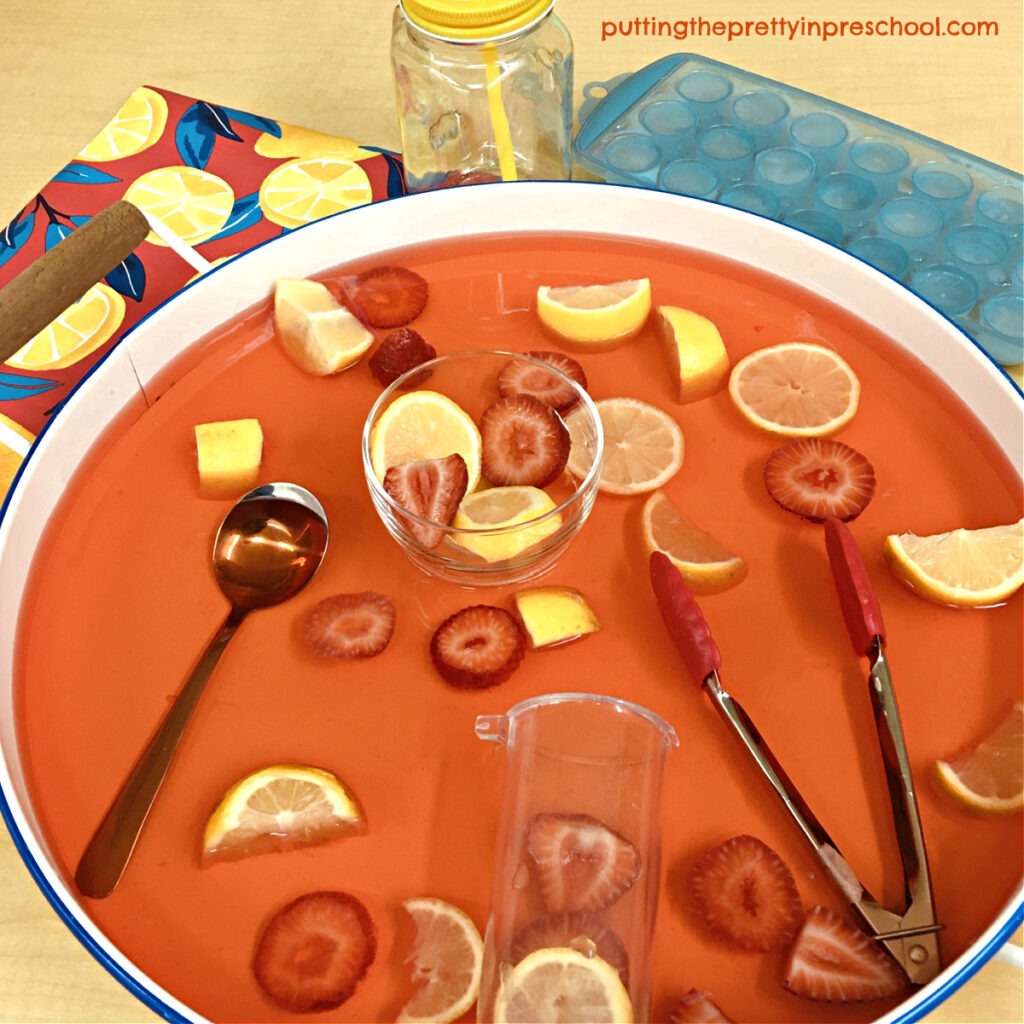 Coral water brightens up this cheery, taste-safe strawberry lemonade sensory tray.