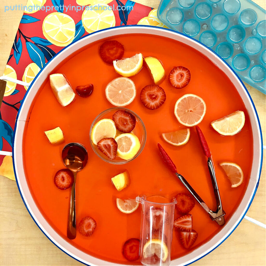 Coral water brightens up this cheery, taste-safe strawberry lemonade sensory tray.