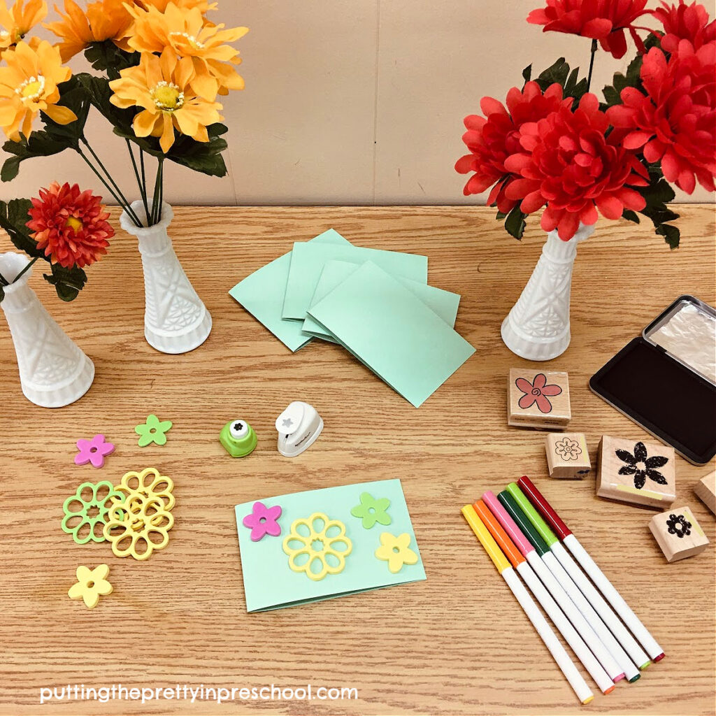 A card-making center compliments a flower stand dramatic play center.