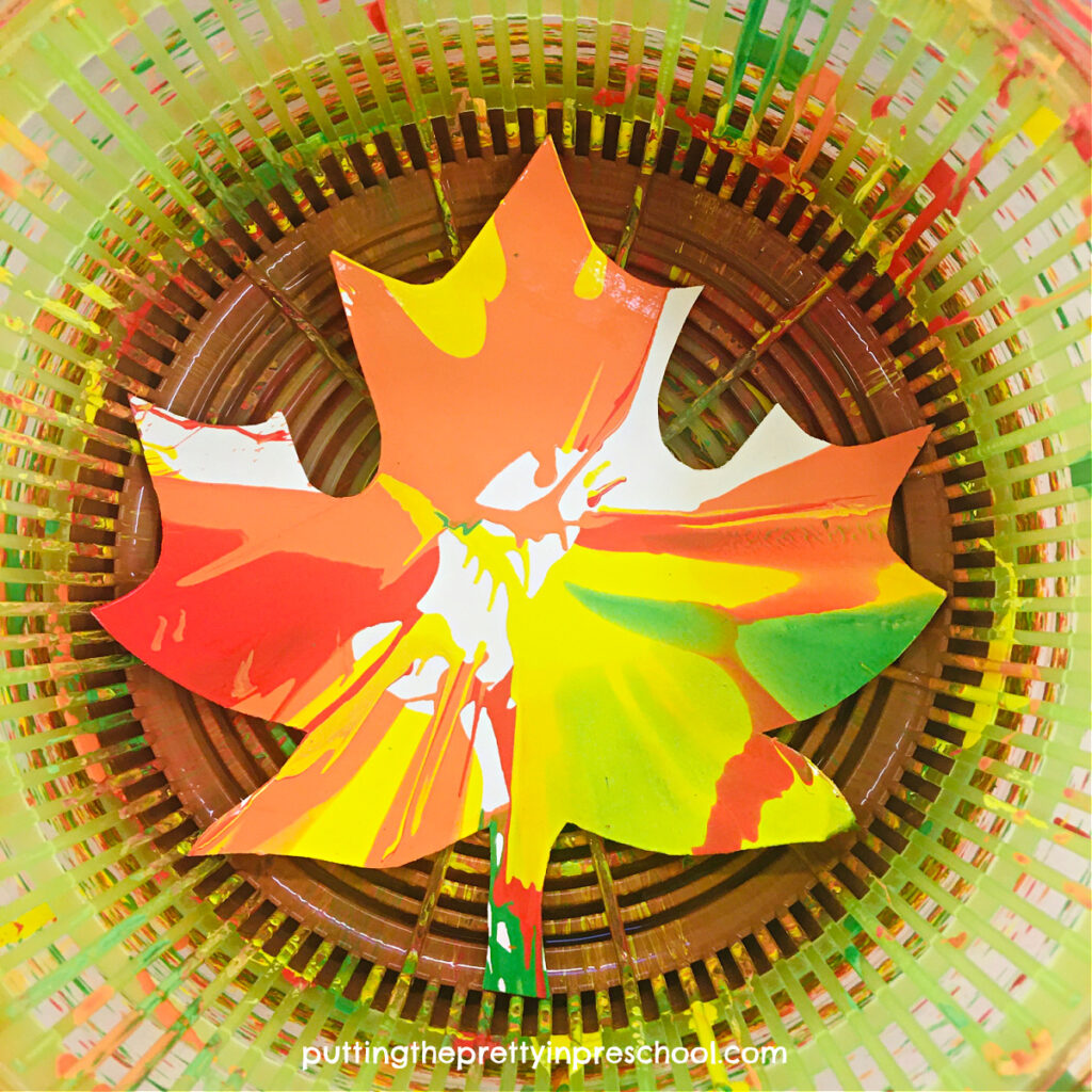 A beautiful painted leaf made with a salad spinner painting technique. This process art project is bound to be a hit with your little learners.
