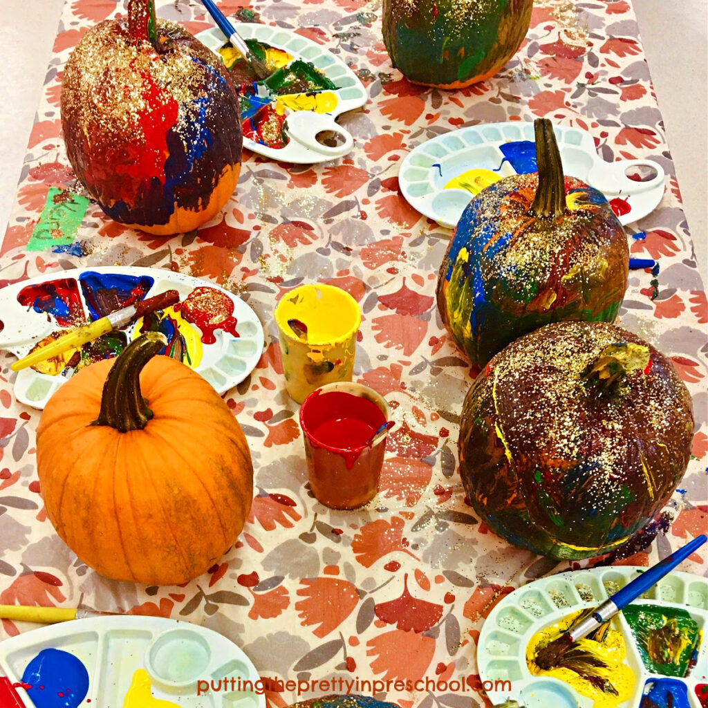 An easy and fun pumpkin painting process art activity everyone will be eager to try. Gold glitter adds glamour to the pumpkins.