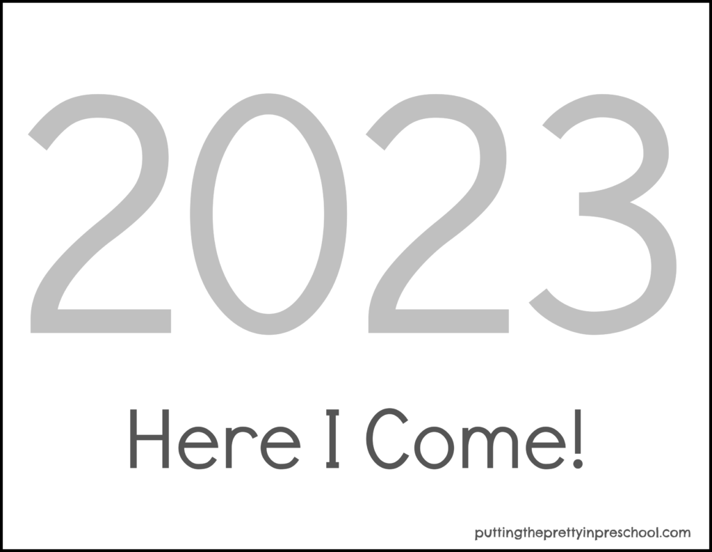 Download this free New Year 2023 silver-numbered printable for making children's keepsake crafts.