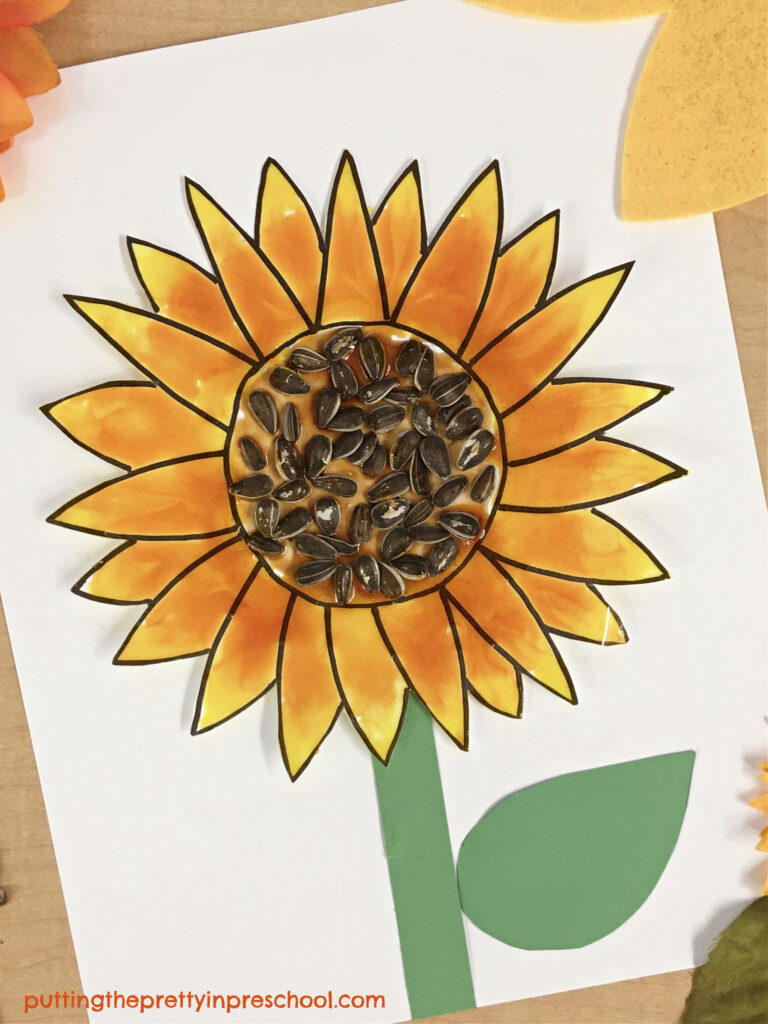 This shiny, corn syrup paint sunflower art project is easy-to-do and looks gorgeous displayed. A free sunflower template is available to download.