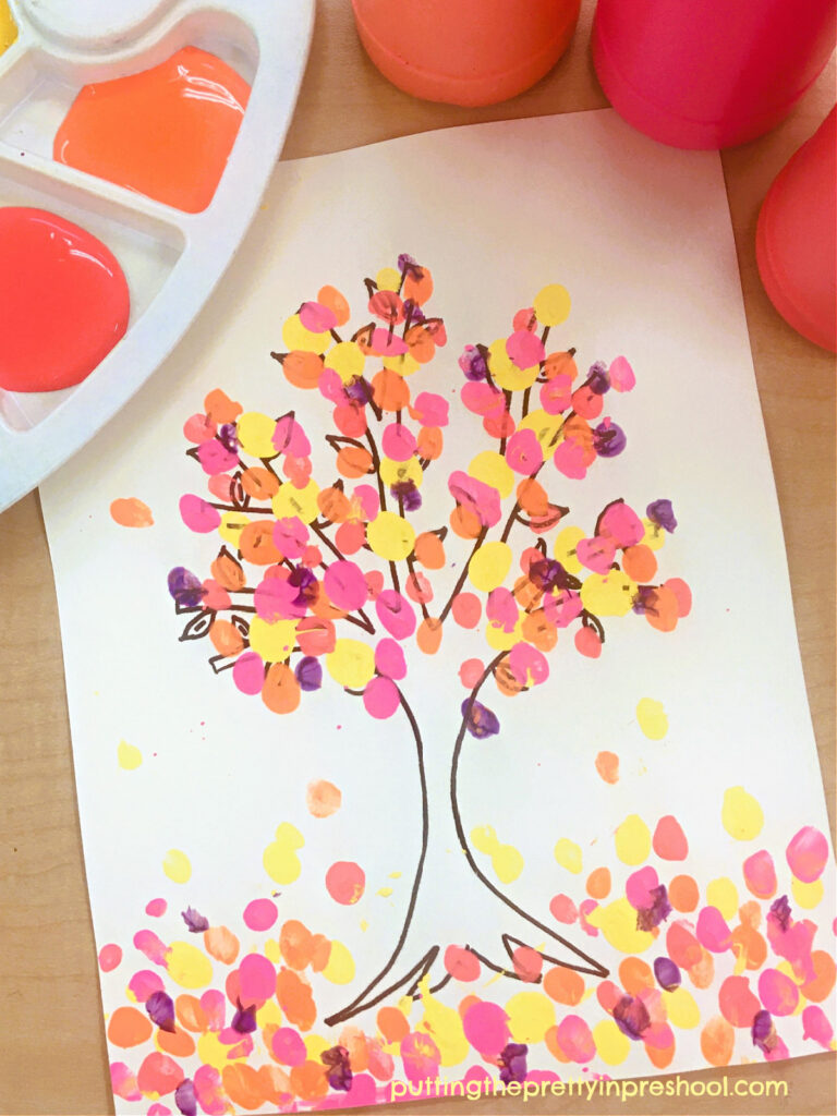 A beautiful, picture-book-inspired neon fingerpaint tree art project the whole family can do. A free tree template is available to download.