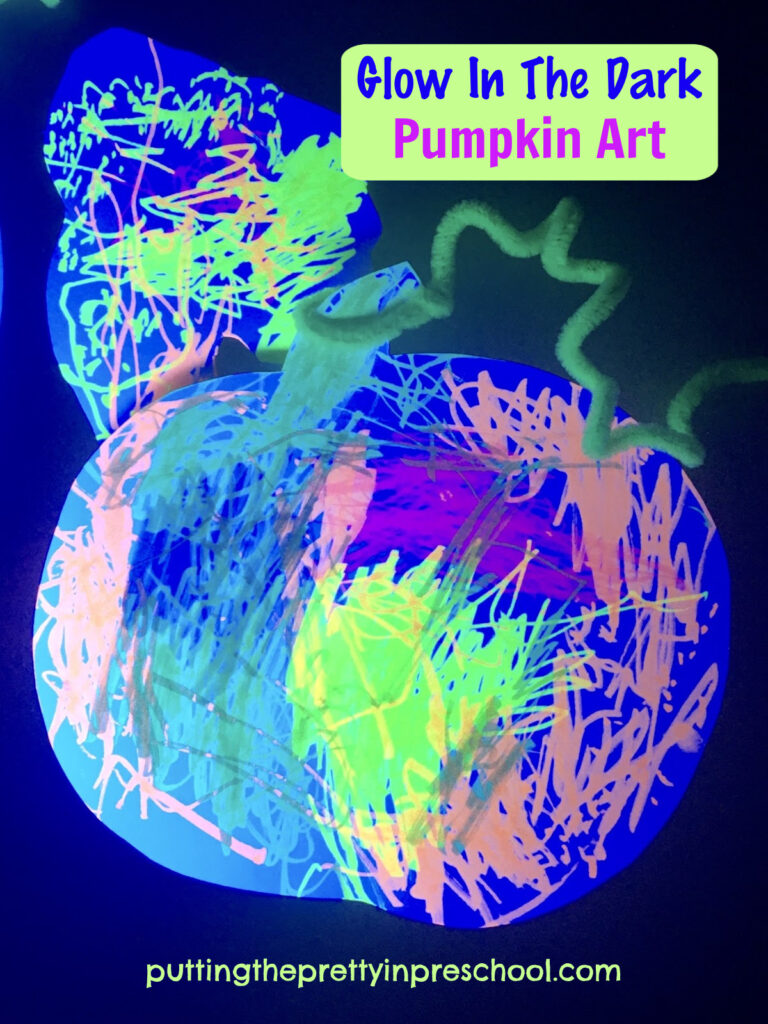 Glow-in-the-dark pumpkin art with white cardstock paper, highlighter markers, and neon pipe cleaners. A stunning art project the whole family can do.