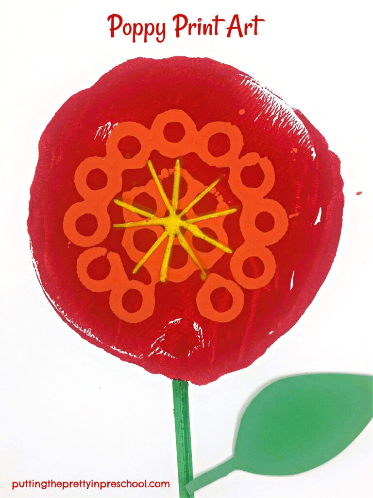 A bubble wand and ground meat chopper paint print add color and definition to this gadget printmaking poppy art project.