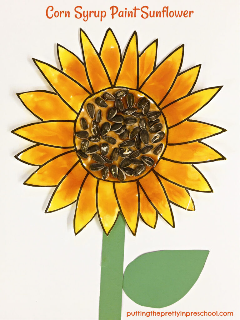 Gorgeous, glossy sunflower art made with a taste-safe, two-ingredient homemade paint recipe. This art project looks stunning when displayed.