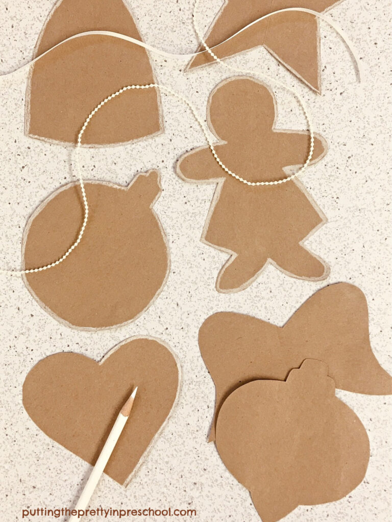 Make these vintage-inspired brown paper bag Christmas ornaments. Download the free templates to make six different designs.