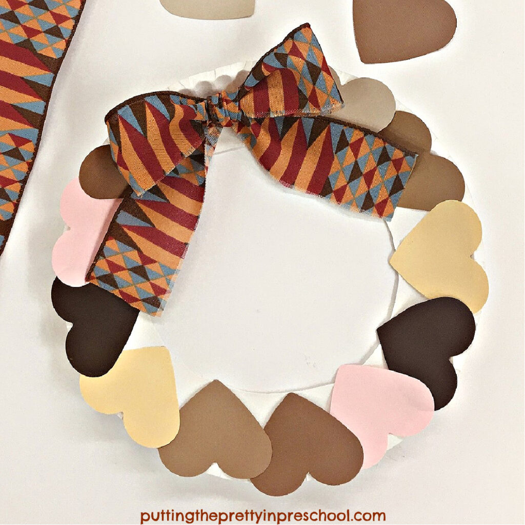 Black History Month ribbon and skin-toned hearts are the highlights of this easy-to-make "kindness" wreath craft.
