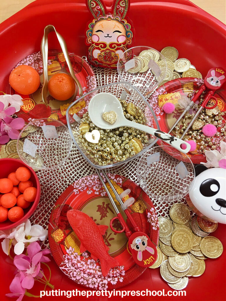 A pretty Chinese New Year sensory tub with a "Year Of The Rabbit" theme. A perfect way to introduce Chinese culture to early learners.