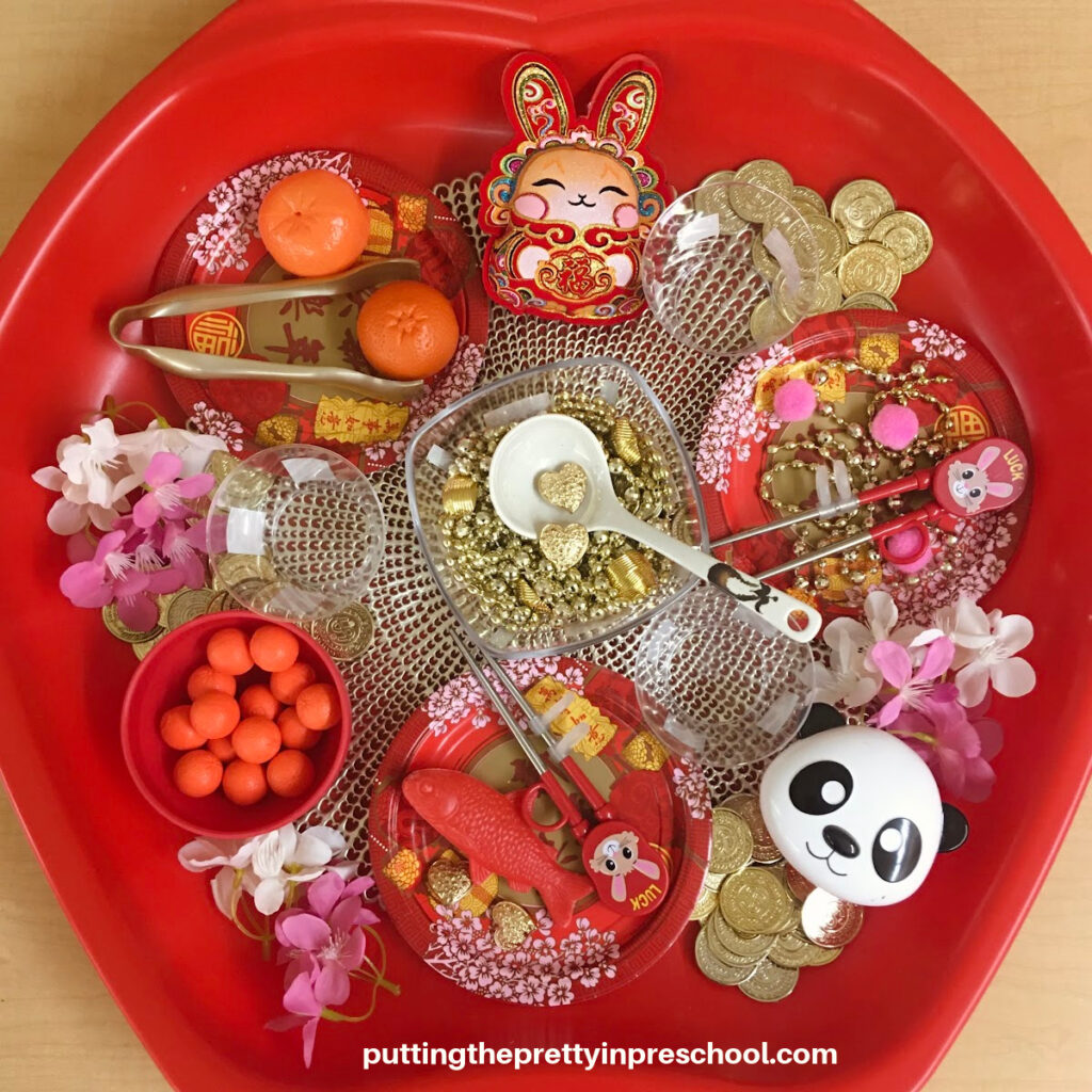 A super inviting Chinese Lunar New Year sensory tub with a "Year Of The Rabbit" theme. A cultural sensory play opportunity your early learners will love.