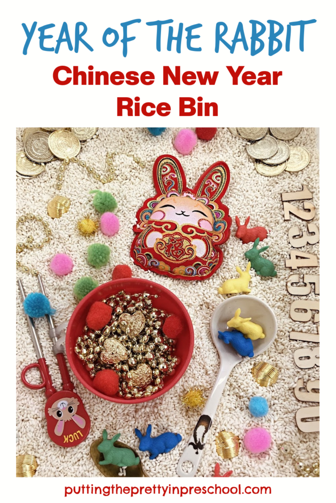 This Chinese New Year rice bin celebrates the Year of The Rabbit. It's filled with loose parts early learners will love to explore.
