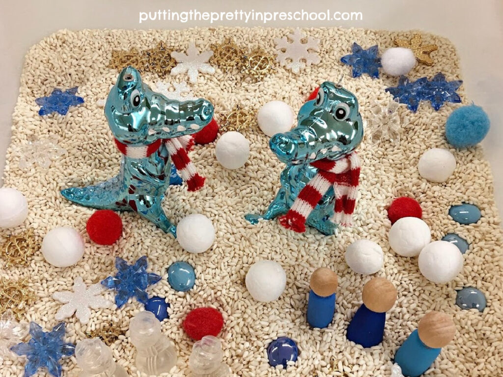 An adorable crocodile-inspired winter sensory bin your little learners will love to play in. An easy-to-prepare rice-based bin.