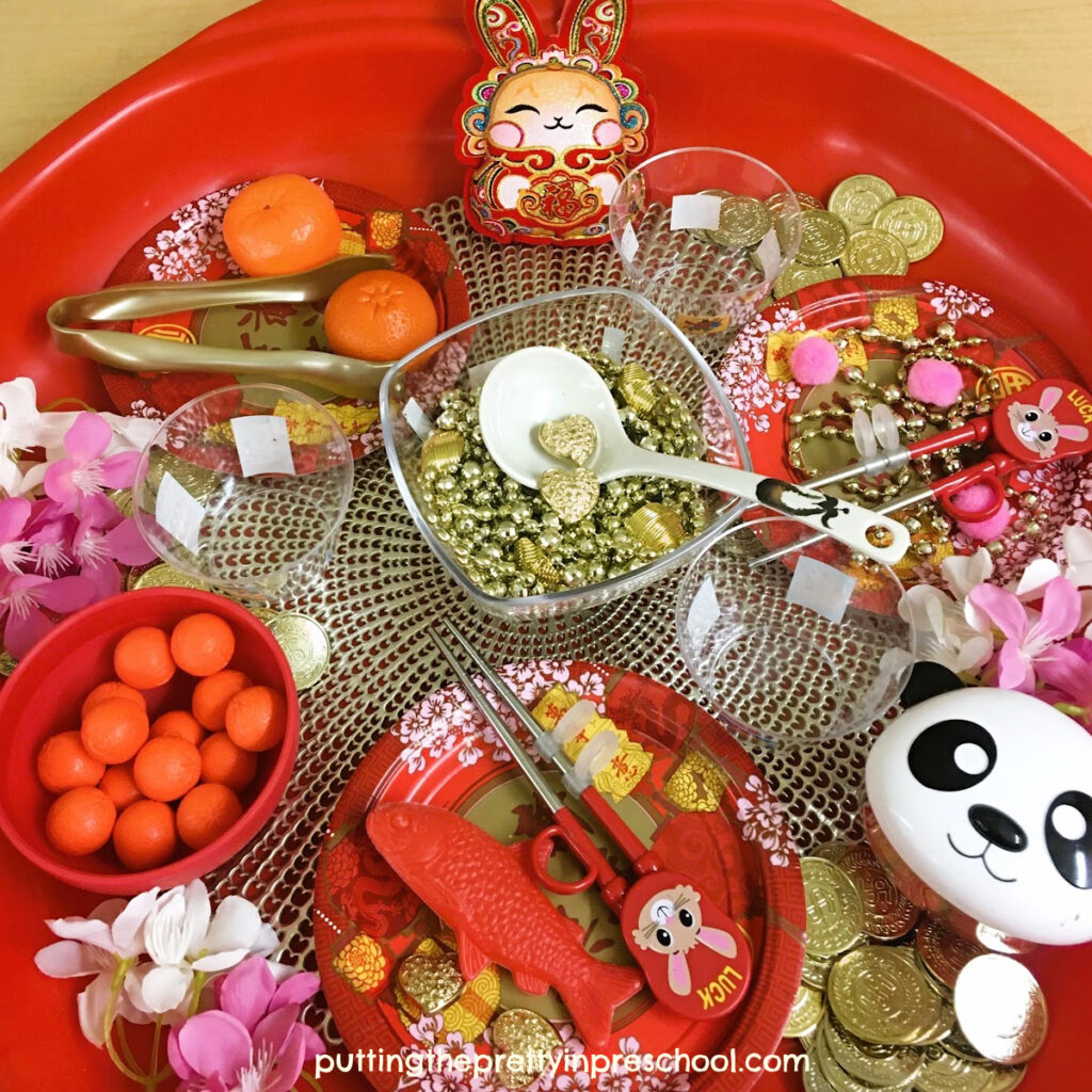 A pretty Lunar New Year sensory tub with a "Year Of The Rabbit" theme. A perfect way to introduce Chinese culture to early learners.