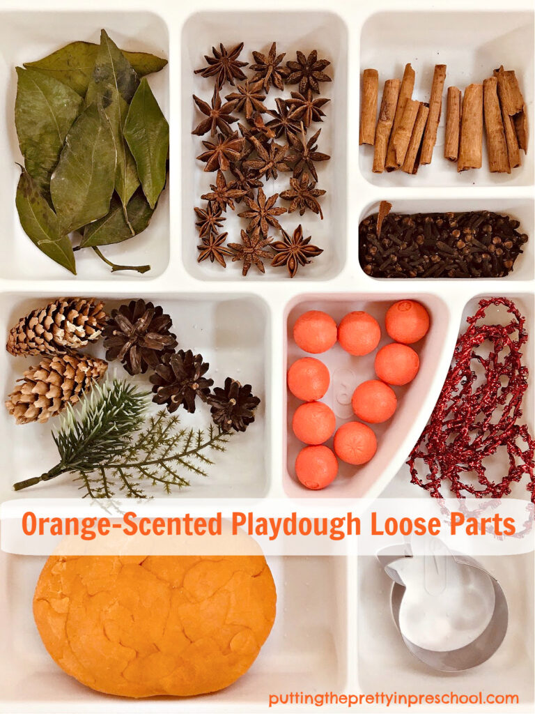 An easy-to-make orange-scented orange playdough recipe showcased with loose parts early learners will love to explore.