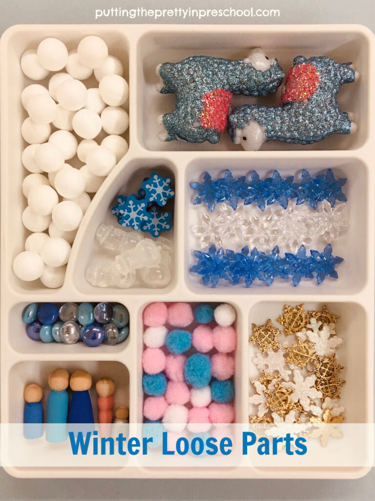 Winter-themed loose parts for a llama-inspired winter rice sensory bin.