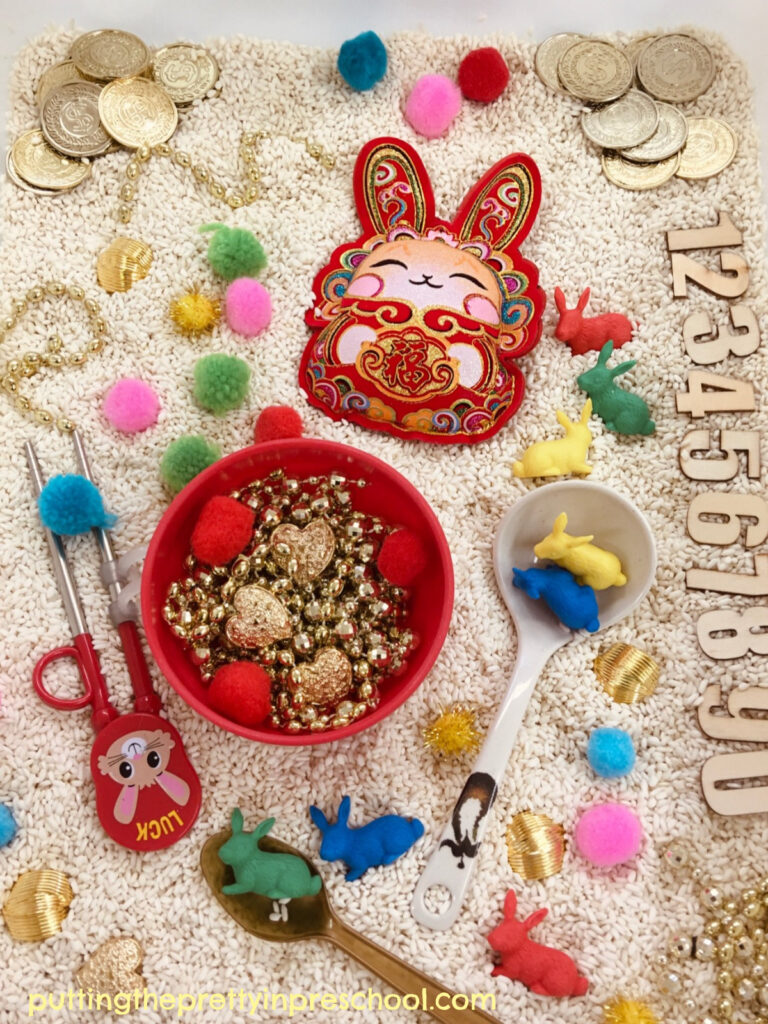 This Chinese New Year rice bin celebrates the Year of The Rabbit. A stuffed rabbit decoration and bunny counters are highlights in the bin.