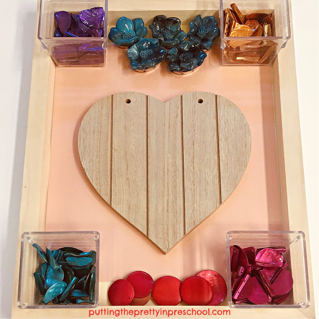 An invitation to create a gorgeous loose-part jewelry heart with costume jewelry pieces. This is an all-ages transient art project everyone will enjoy.