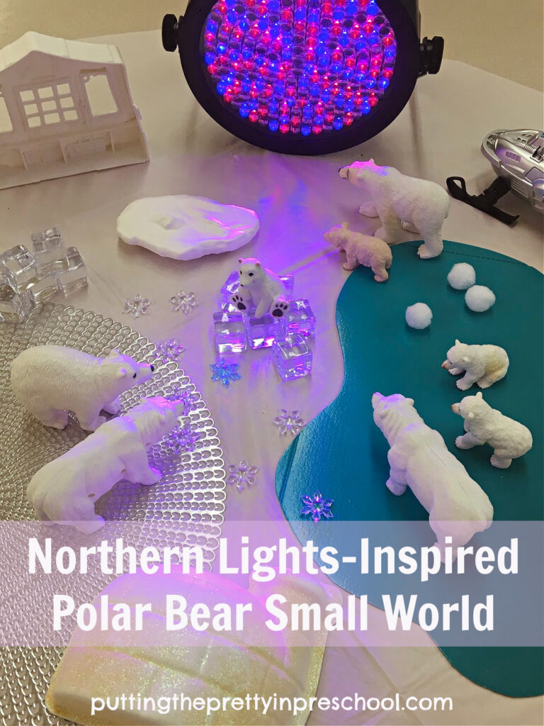A professional stage light adds interest to this northern lights-inspired polar bear small world.