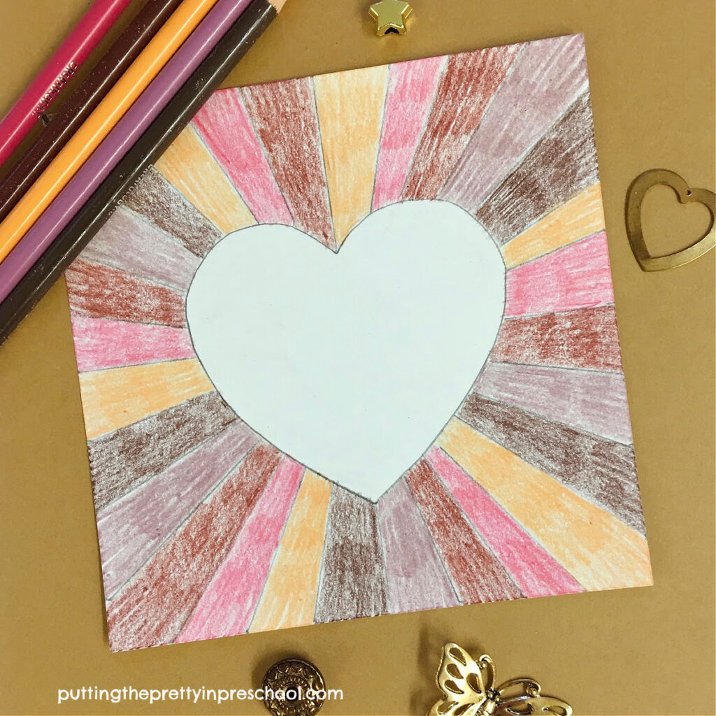 A "Celebrate Diversity" sunburst heart art project with skin tone pencil crayons. An all-ages, non-messy, stunning art activity.