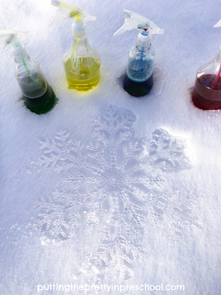 An invitation to create a spray paint snowflake silhouette outdoors. A quick and easy transient art activity with stunning results.