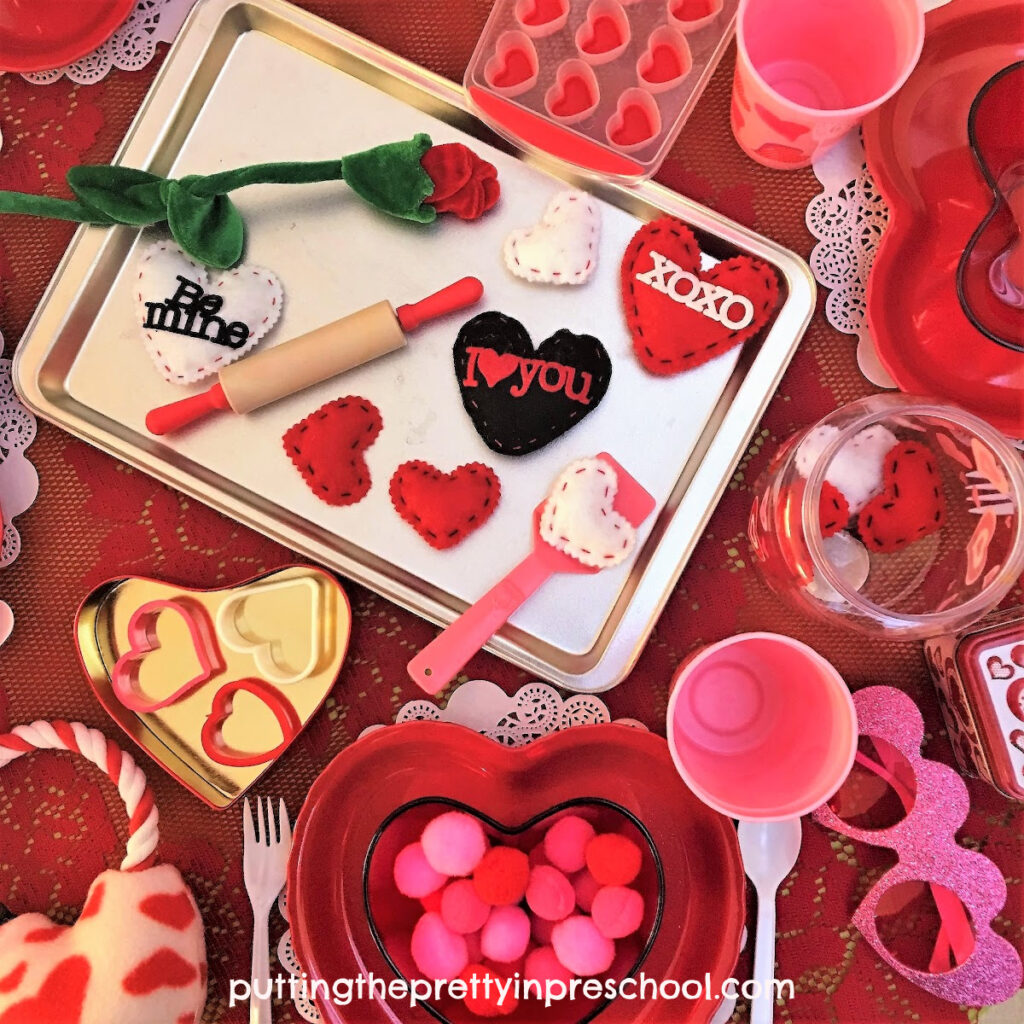 Heart-themed accessories take center stage in this Valentine's Day dramatic play invitation.