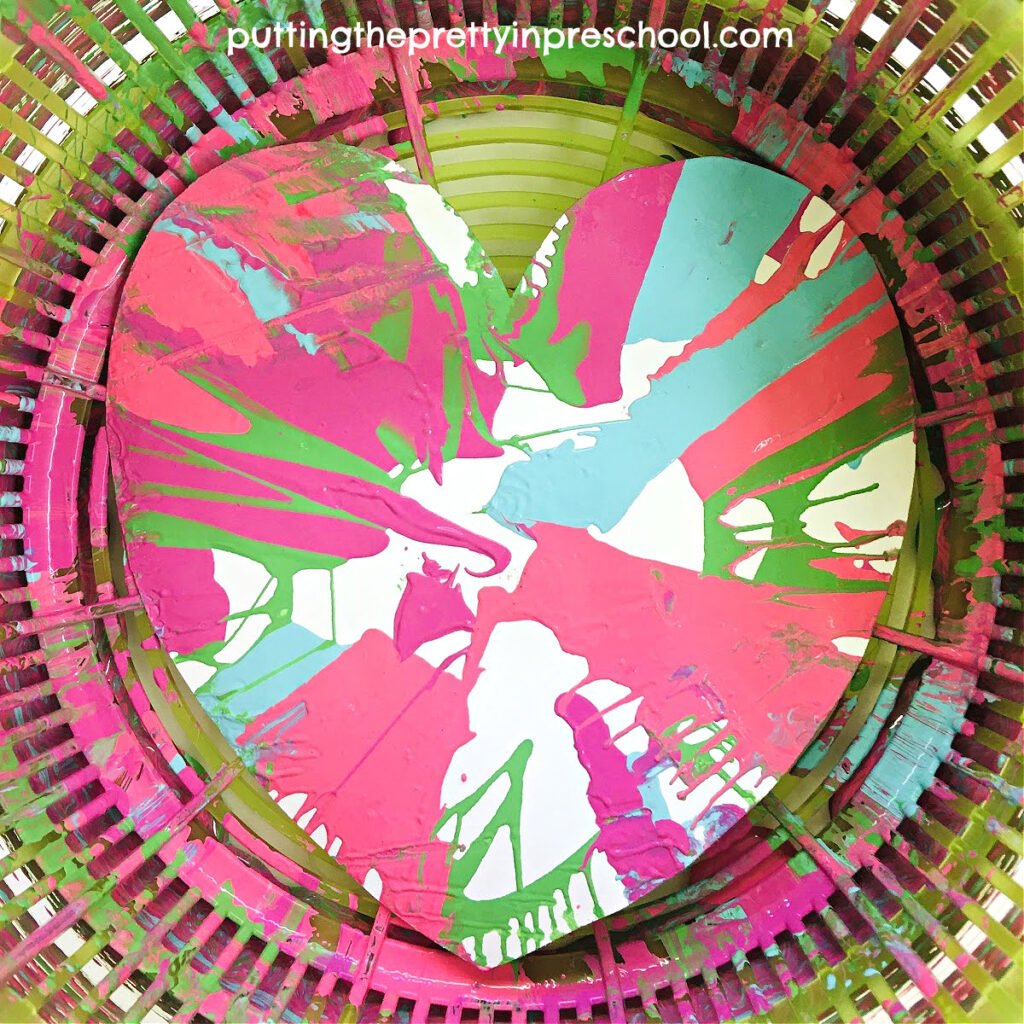 A must-try easy and fun salad spinner heart art activity your little learners will love, This is process art at its best.