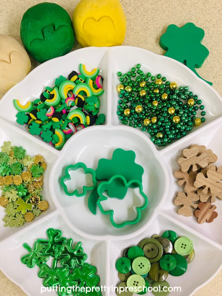 Set out this fun St. Patrick's day playdough tray for your little learners to explore. Three different colors of playdough are featured.