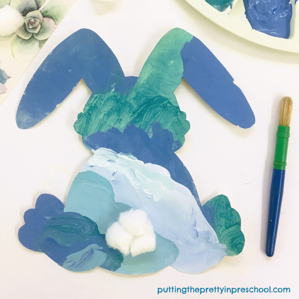 A cotton ball tail accents this easy-to-do ombre-painted spring bunny art project you are sure to love.