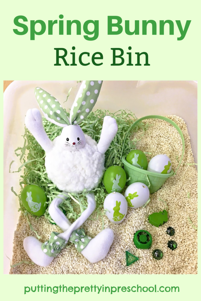 Usher in spring in fashion with this bunny rice bin. A long-legged bunny and green and white eggs and loose parts are in the bin.