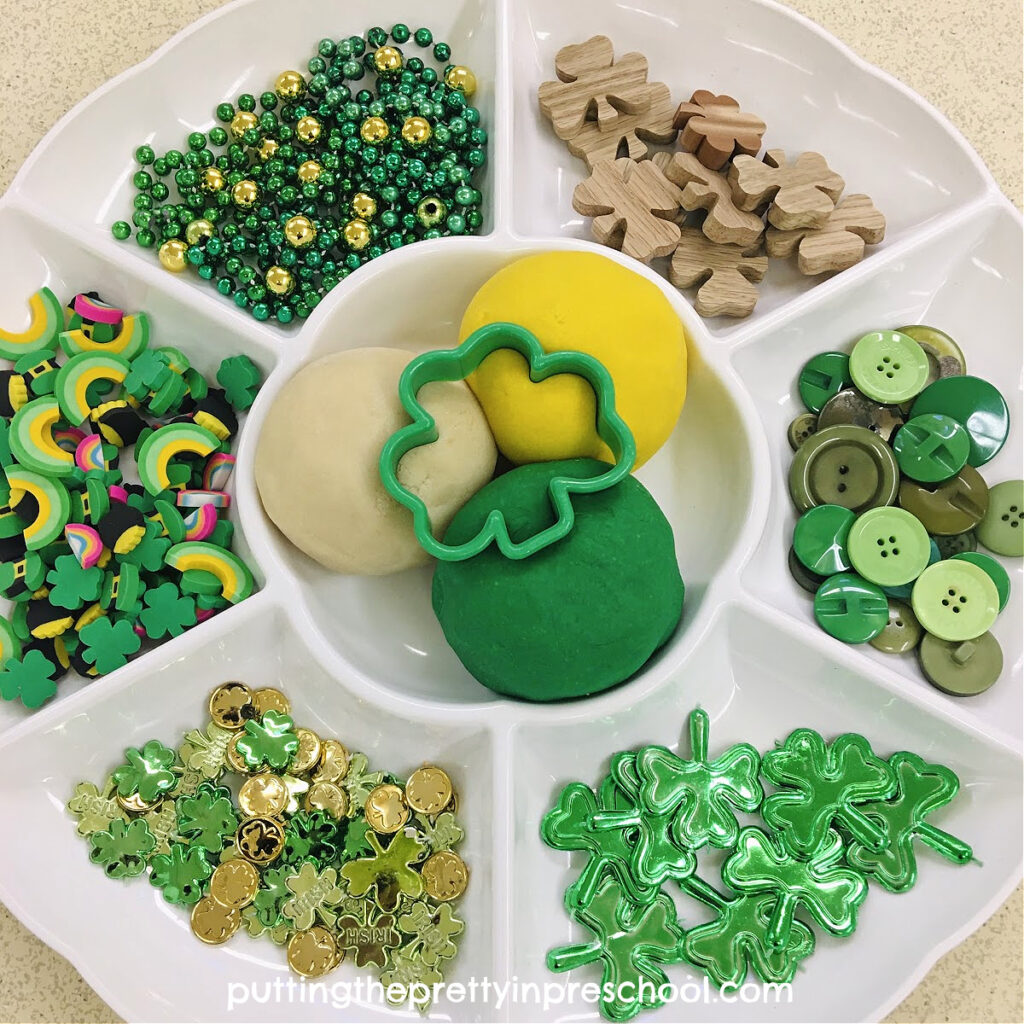 Set out this fun St. Patrick's day playdough tray for your little learners to explore. Three different colors of playdough are featured.