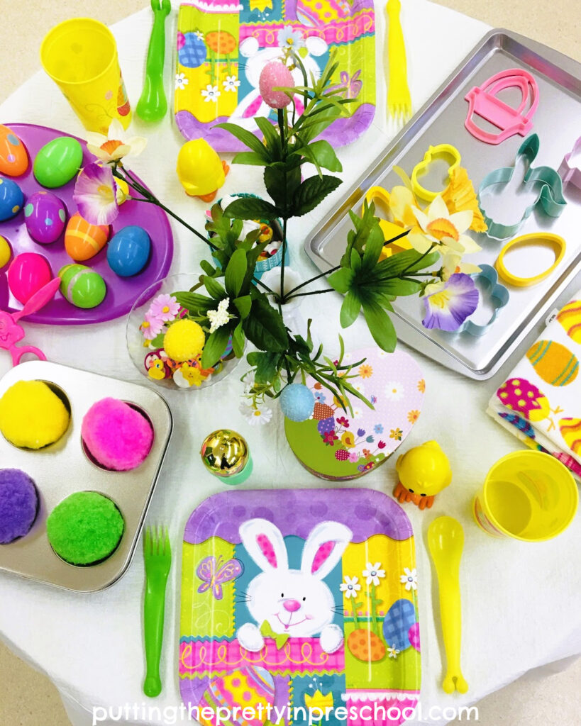 Easter-themed loose parts and decor are key supplies in a dramatic play tablescape your little learners will love to explore.