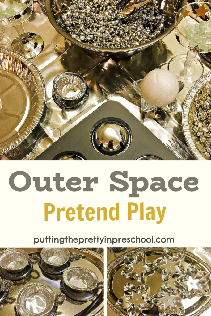 Shiny, metallic loose parts are the highlight of this outer space pretend play tablescape your little learners will love to explore.