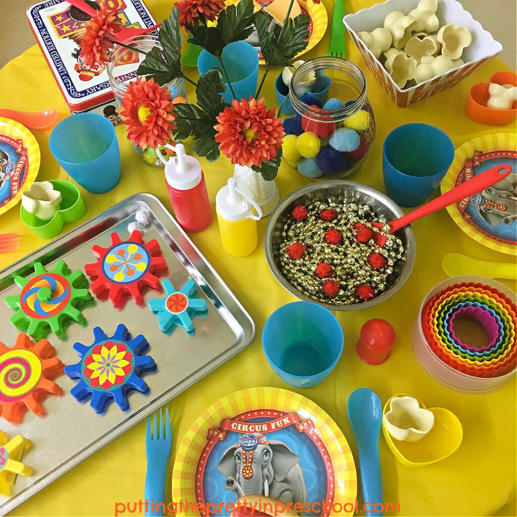 Bright and cheery loose parts add plenty of color to this super fun circus pretend play tablescape your little learners will absolutely love.