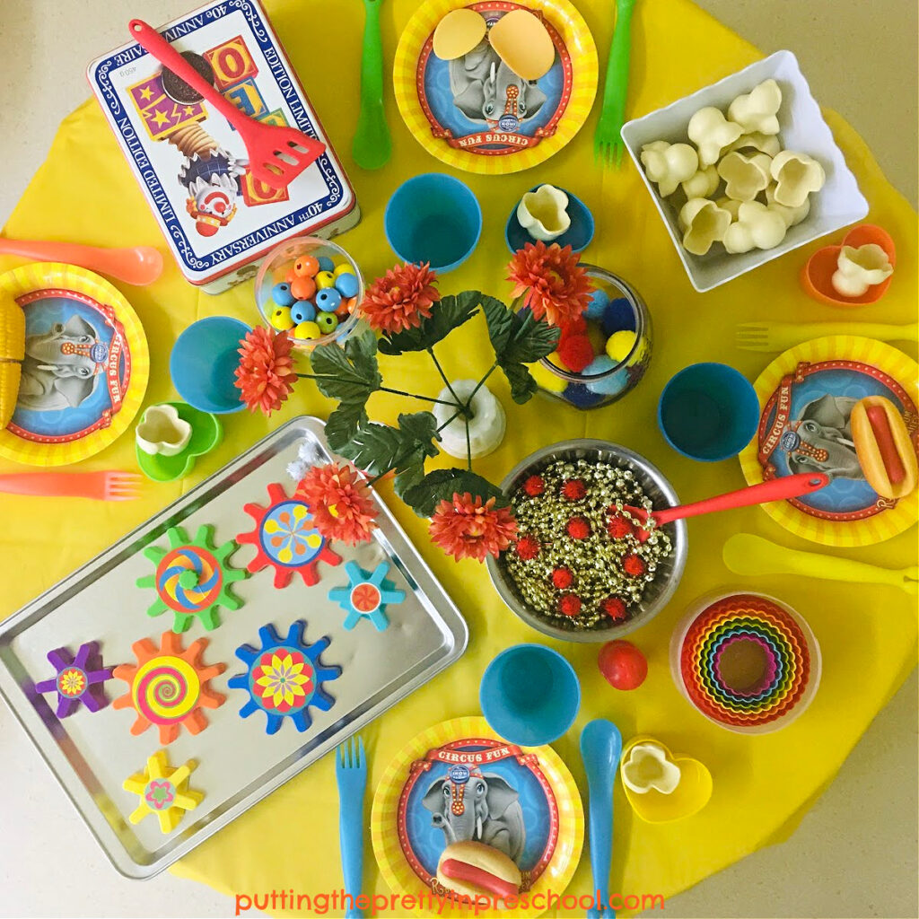 This circus pretend play tablescape adds a whole lotta color and fun to a circus theme. Many interesting loose inspire imaginative play.