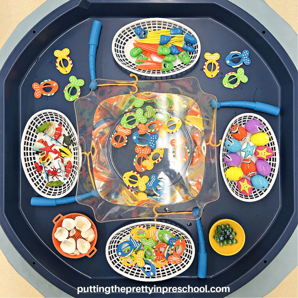 Fishing sets and ocean-themed loose parts are featured in this super fun "Go Fishing" active world tray your early learners will love.