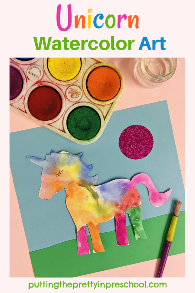 Beautiful unicorn watercolor art project with non-toxic tempera paint pucks and fadeless construction paper. Free unicorn printable to download.