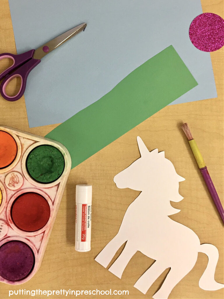 Supplies to create a stinning unicorn scene with tempera paint pucks and fadeless construction paper. A free unicorn template is available to download.